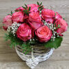 Pink rose arrangement in basket