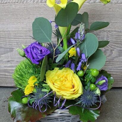 Early summer arrangement with calla lilies yellow/purple