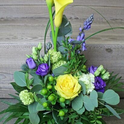 Tiered early summer bouquet with calla lilies yellow/purple