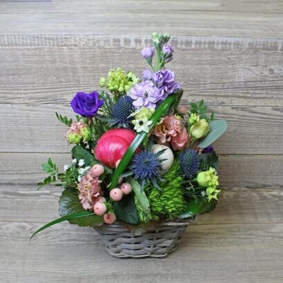 Colorful early summer arrangement in the basket