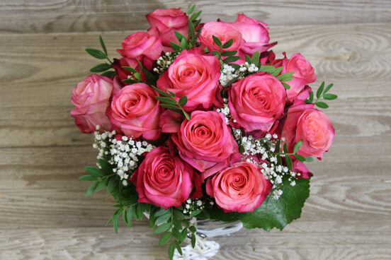 Pink rose arrangement in basket