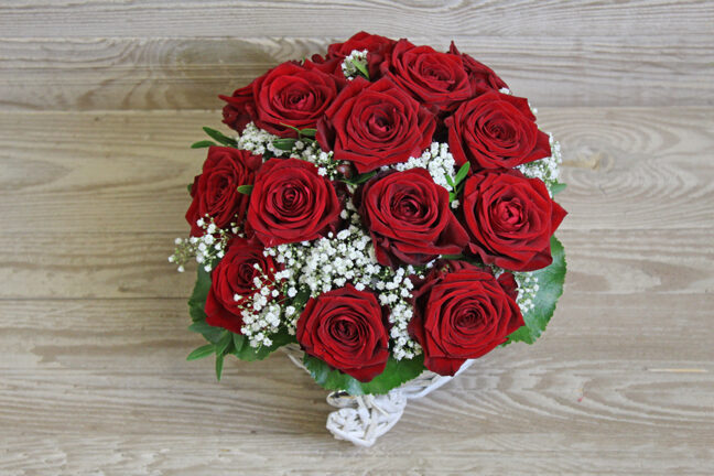 Red rose arrangement in basket